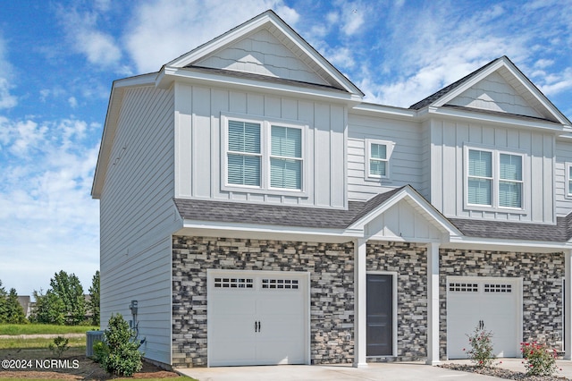 2133 Kali Ln Unit A, Greenville, NC 27834 - view of front of property with an attached garage, board and batten siding, driveway, and cooling unit