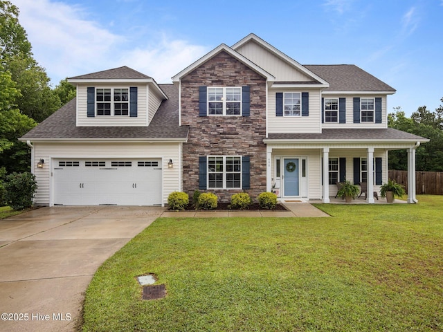 608 Creek Ct, Swansboro, NC 28584 - view of front of property with concrete driveway, a shingled roof, stone siding, a garage, and a porch