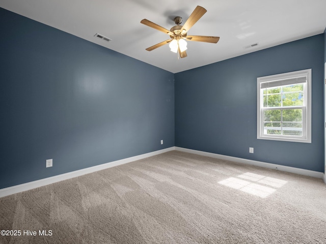 608 Creek Ct, Swansboro, NC 28584 - empty room with ceiling fan, baseboards, and carpet