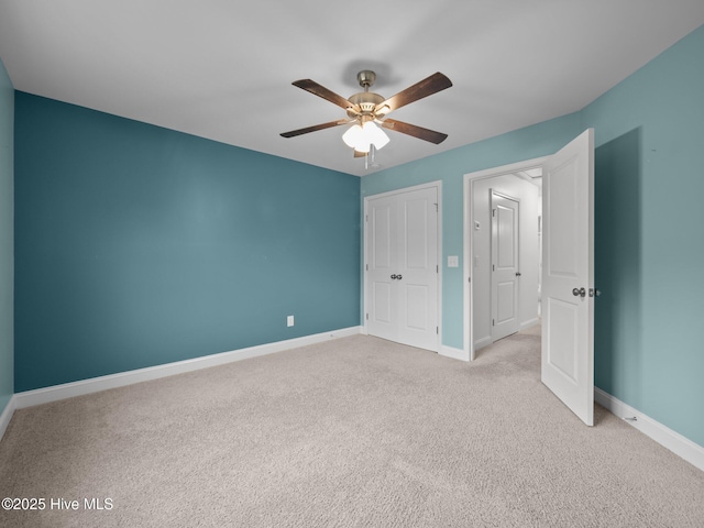 608 Creek Ct, Swansboro, NC 28584 - unfurnished bedroom with carpet, baseboards, ceiling fan, and a closet