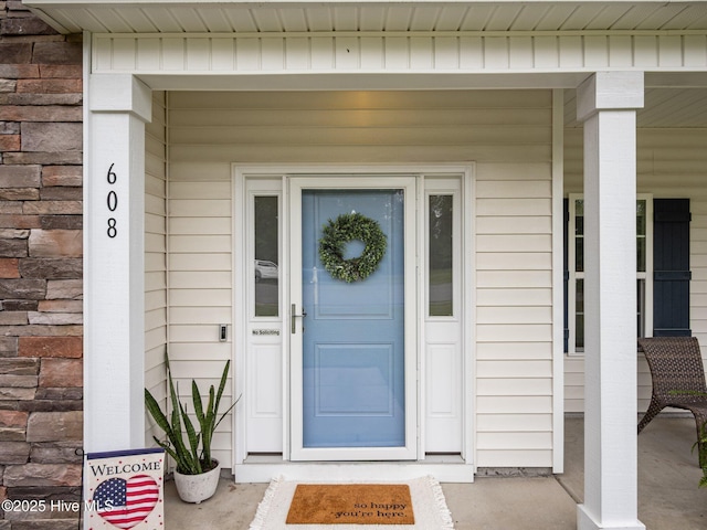 608 Creek Ct, Swansboro, NC 28584 - doorway to property featuring covered porch