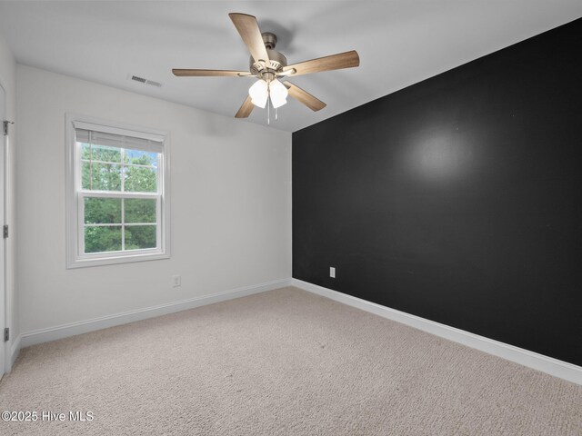 608 Creek Ct, Swansboro, NC 28584 - unfurnished room featuring carpet floors, a ceiling fan, and baseboards