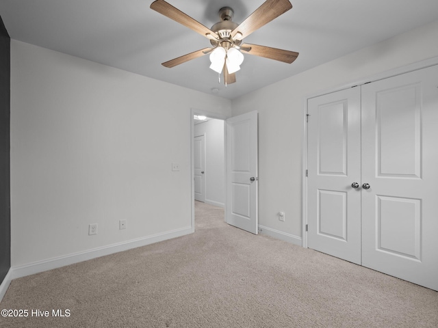 608 Creek Ct, Swansboro, NC 28584 - unfurnished bedroom featuring carpet flooring, baseboards, a closet, and a ceiling fan