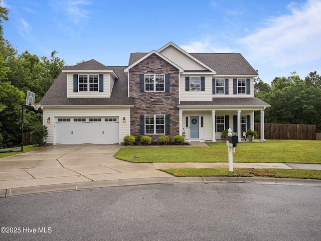 608 Creek Ct, Swansboro, NC 28584 - view of front of property with concrete driveway, stone siding, covered porch, and roof with shingles
