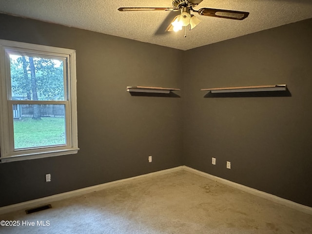 108 Red Oak Dr, Goldsboro, NC 27530 - carpeted spare room with healthy amount of natural light, a ceiling fan, baseboards, and a textured ceiling