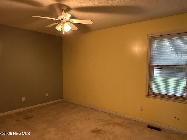 108 Red Oak Dr, Goldsboro, NC 27530 - unfurnished room with light carpet, a ceiling fan, a textured ceiling, and baseboards