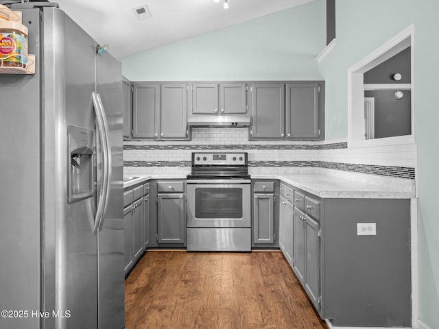 329 Buckhead Rd, Hubert, NC 28539 - kitchen featuring stainless steel appliances, gray cabinets, lofted ceiling, tasteful backsplash, and light countertops