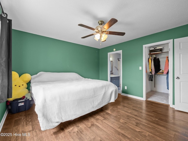 329 Buckhead Rd, Hubert, NC 28539 - bedroom with wood finished floors, baseboards, a closet, and ensuite bath