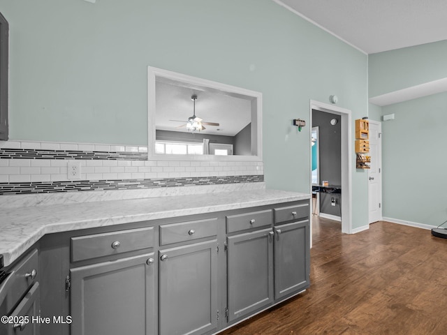 329 Buckhead Rd, Hubert, NC 28539 - kitchen featuring gray cabinets, decorative backsplash, ceiling fan, dark wood-style floors, and light stone counters
