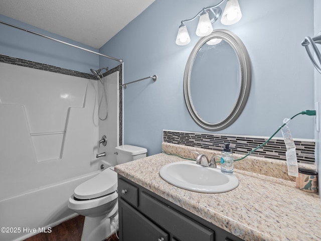 329 Buckhead Rd, Hubert, NC 28539 - bathroom featuring bathing tub / shower combination, vanity, toilet, decorative backsplash, and wood finished floors