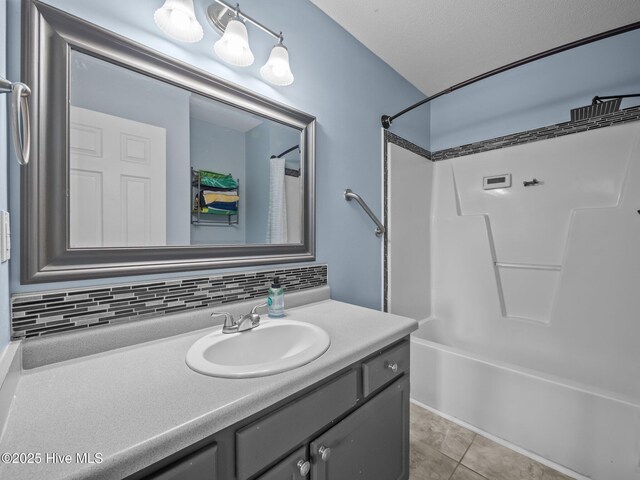 329 Buckhead Rd, Hubert, NC 28539 - bathroom featuring vanity,  shower combination, backsplash, and tile patterned flooring