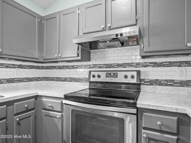 329 Buckhead Rd, Hubert, NC 28539 - kitchen featuring electric range, gray cabinetry, range hood, backsplash, and light stone counters