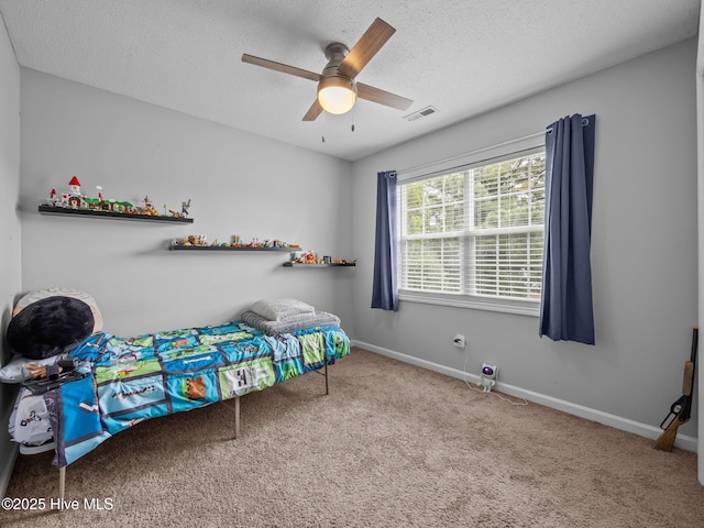 329 Buckhead Rd, Hubert, NC 28539 - bedroom featuring carpet, a textured ceiling, baseboards, and ceiling fan