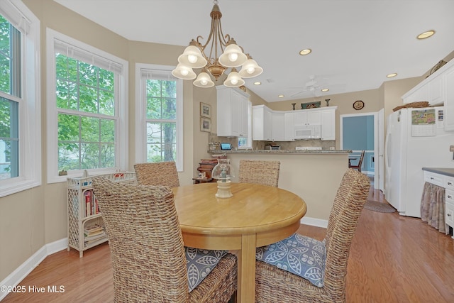3856 Harmony Cir, Southport, NC 28461 - dining room featuring light wood-style flooring, a chandelier, baseboards, recessed lighting, and a ceiling fan