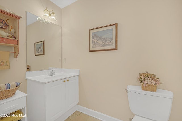 3856 Harmony Cir, Southport, NC 28461 - bathroom with toilet, vanity, baseboards, and tile patterned floors
