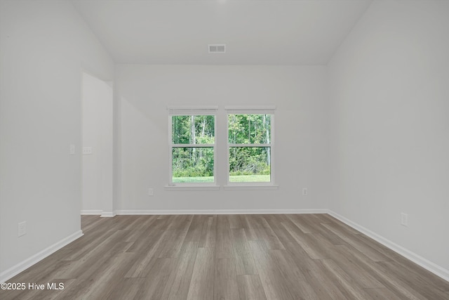 6437 Twinspur Ct SW, Ocean Isle Beach, NC 28469 - unfurnished room featuring wood finished floors and baseboards