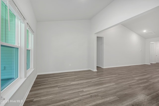 6437 Twinspur Ct SW, Ocean Isle Beach, NC 28469 - unfurnished room featuring wood finished floors, plenty of natural light, and recessed lighting