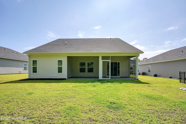 6437 Twinspur Ct SW, Ocean Isle Beach, NC 28469 - rear view of house featuring a yard and a patio