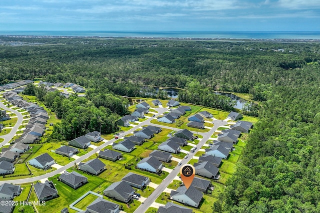 6437 Twinspur Ct SW, Ocean Isle Beach, NC 28469 - aerial view of residential area featuring a heavily wooded area and a nearby body of water