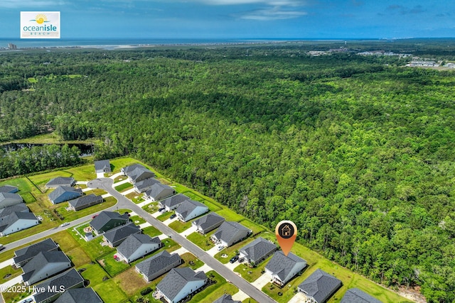 6437 Twinspur Ct SW, Ocean Isle Beach, NC 28469 - aerial perspective of suburban area with a heavily wooded area