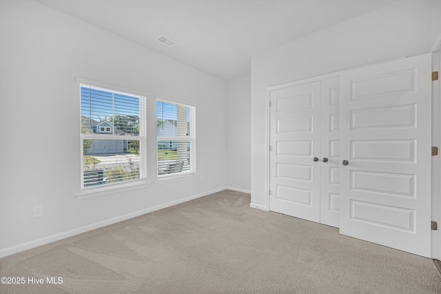 6437 Twinspur Ct SW, Ocean Isle Beach, NC 28469 - unfurnished bedroom with carpet flooring and a closet