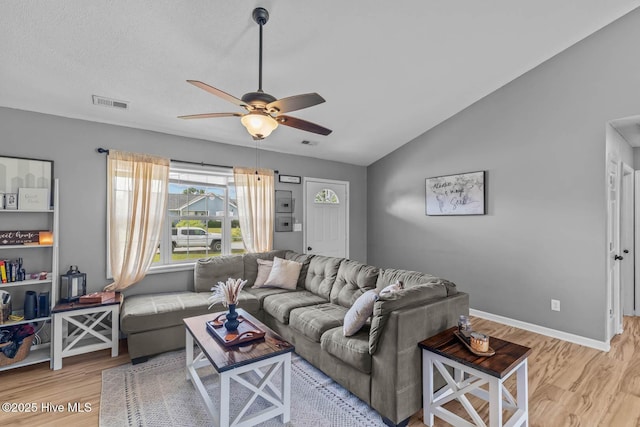 425 Dion Dr, Hubert, NC 28539 - living room with wood finished floors, ceiling fan, lofted ceiling, and baseboards