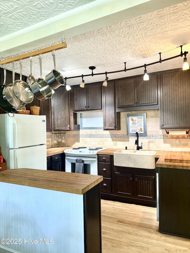 2210 Klein Rd, Wilmington, NC 28405 - kitchen featuring wood counters, white appliances, a sink, an ornate ceiling, and light wood-style floors