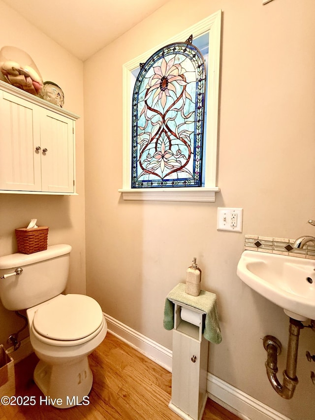 2210 Klein Rd, Wilmington, NC 28405 - bathroom featuring wood finished floors, baseboards, and toilet