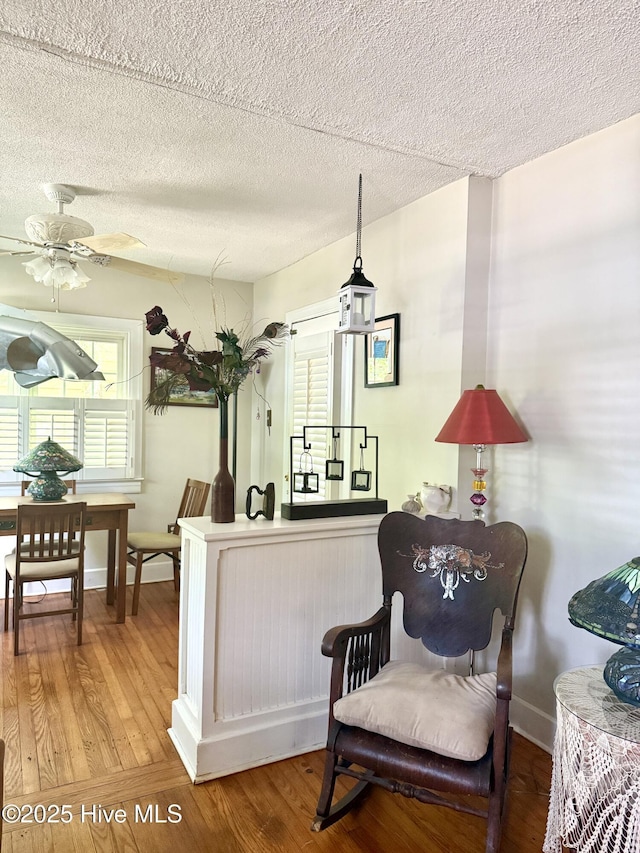 2210 Klein Rd, Wilmington, NC 28405 - living area with wood finished floors, a textured ceiling, baseboards, and ceiling fan