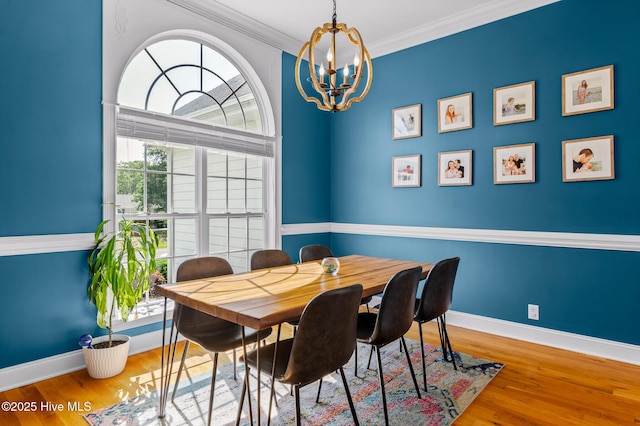 1682 Gores Landing Rd SW, Ocean Isle Beach, NC 28469 - dining area featuring a chandelier, wood finished floors, baseboards, and crown molding