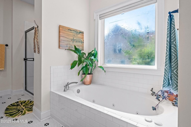 1682 Gores Landing Rd SW, Ocean Isle Beach, NC 28469 - bathroom with a shower stall, tile patterned flooring, a whirlpool tub, and baseboards
