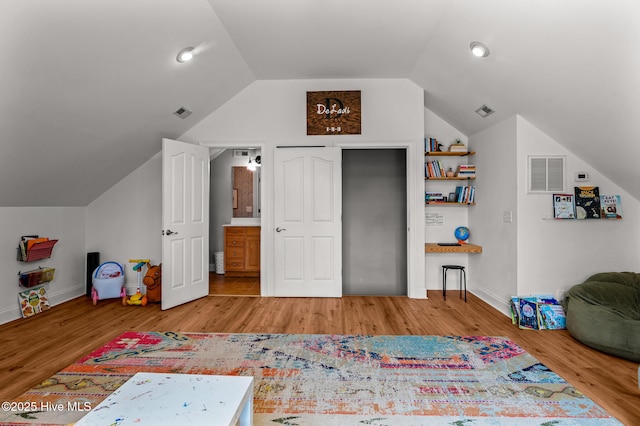 1682 Gores Landing Rd SW, Ocean Isle Beach, NC 28469 - playroom featuring lofted ceiling, wood finished floors, baseboards, and recessed lighting