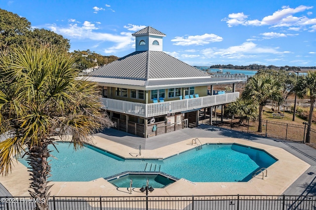 1682 Gores Landing Rd SW, Ocean Isle Beach, NC 28469 - community pool with a hot tub, a patio area, and a water view