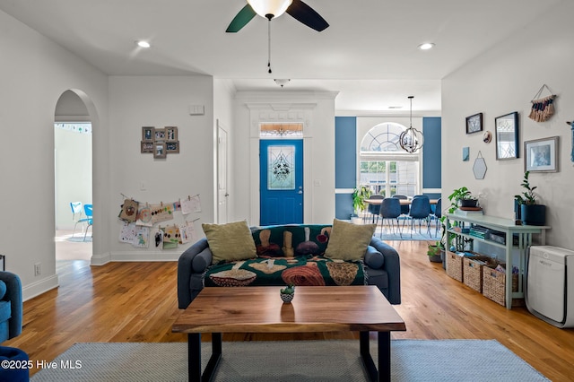 1682 Gores Landing Rd SW, Ocean Isle Beach, NC 28469 - living room featuring arched walkways, light wood-type flooring, ceiling fan, recessed lighting, and baseboards