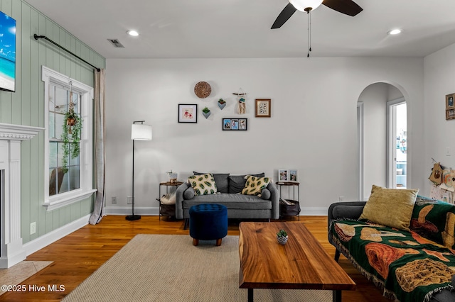 1682 Gores Landing Rd SW, Ocean Isle Beach, NC 28469 - living room with arched walkways, wood finished floors, baseboards, ceiling fan, and recessed lighting