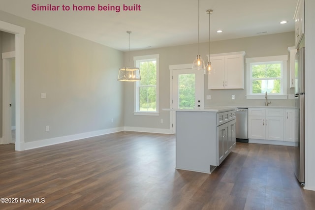 129 Bayview Trl, Edenton, NC 27932 - kitchen featuring stainless steel appliances, dark wood-type flooring, white cabinets, light countertops, and recessed lighting