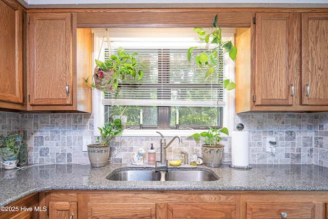 923 Persimmon Pl, Winterville, NC 28590 - kitchen featuring a sink, tasteful backsplash, and brown cabinetry