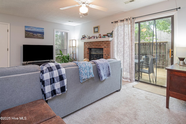 923 Persimmon Pl, Winterville, NC 28590 - carpeted living room with ceiling fan and a fireplace