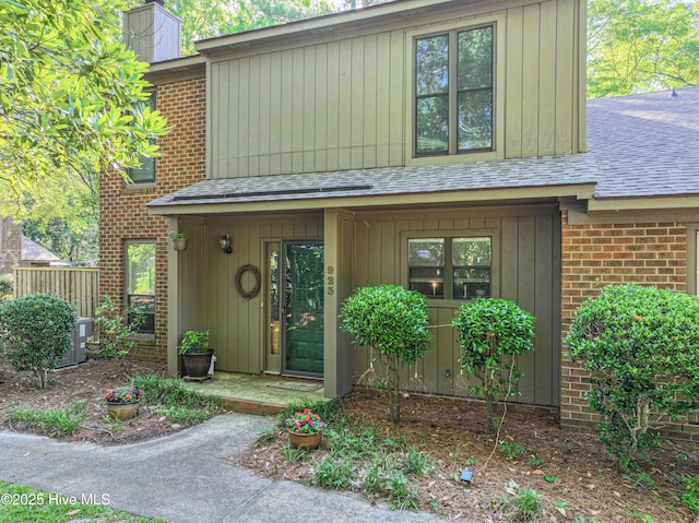 923 Persimmon Pl, Winterville, NC 28590 - view of front of home with brick siding, roof with shingles, and a chimney