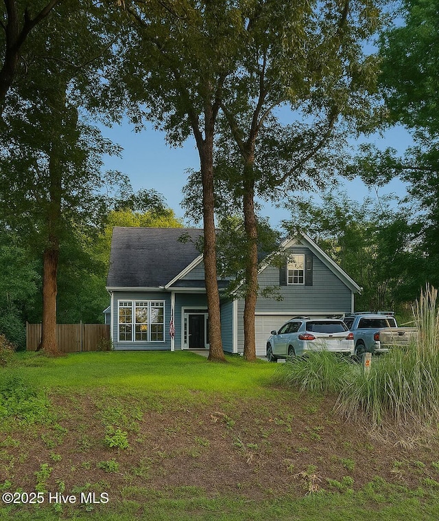 214 Doral Dr, Hampstead, NC 28443 - rear view of house featuring an attached garage