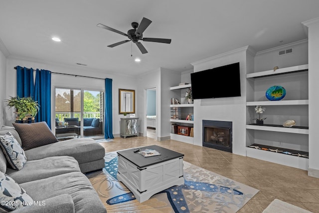 404 Penny Ln Unit F, Morehead City, NC 28557 - living area featuring ornamental molding, built in shelves, tile patterned floors, a ceiling fan, and baseboards