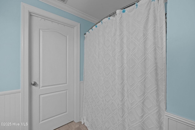 404 Penny Ln Unit F, Morehead City, NC 28557 - full bath with wainscoting, ornamental molding, and wood finished floors