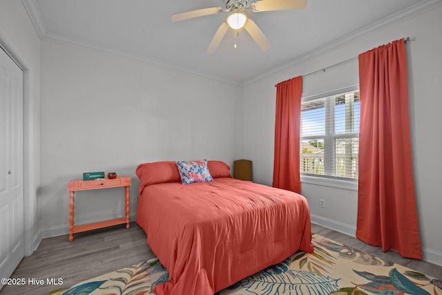 404 Penny Ln Unit F, Morehead City, NC 28557 - bedroom featuring wood finished floors, ornamental molding, baseboards, and a ceiling fan