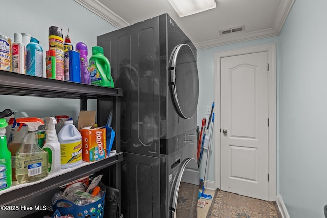 404 Penny Ln Unit F, Morehead City, NC 28557 - laundry area featuring estacked washer and dryer, crown molding, and baseboards