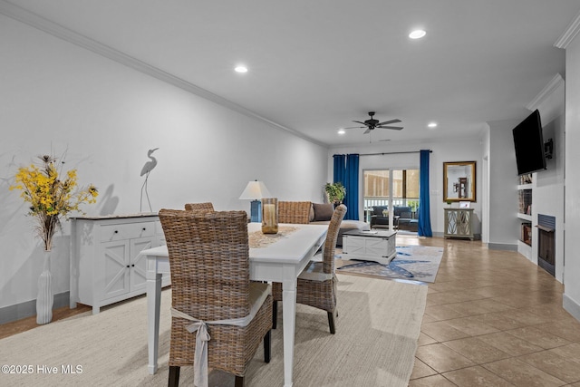 404 Penny Ln Unit F, Morehead City, NC 28557 - dining room featuring ornamental molding, ceiling fan, recessed lighting, a fireplace, and baseboards