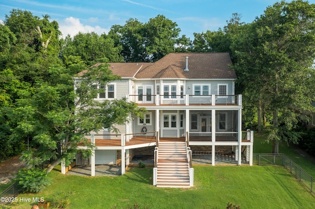 1911 Middle Sound Loop Rd, Wilmington, NC 28411 - rear view of property featuring a balcony, a fenced backyard, stairway, a sunroom, and a gate