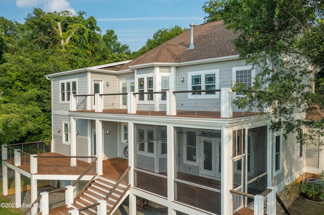 1911 Middle Sound Loop Rd, Wilmington, NC 28411 - back of property with a balcony, a shingled roof, and a sunroom