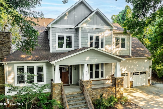1911 Middle Sound Loop Rd, Wilmington, NC 28411 - craftsman-style house featuring roof with shingles, a porch, driveway, and board and batten siding