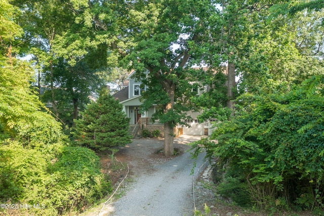 1911 Middle Sound Loop Rd, Wilmington, NC 28411 - view of front facade featuring dirt driveway and stone siding