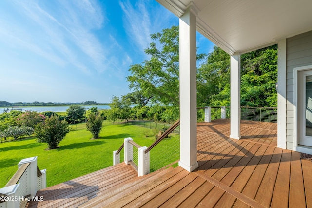 1911 Middle Sound Loop Rd, Wilmington, NC 28411 - wooden deck with a water view and a lawn